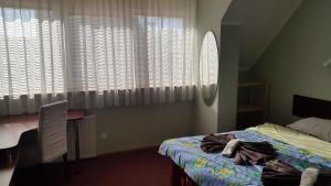 Una cama o camas en una habitación de Terve Hostel