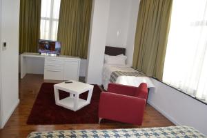 Rúm í herbergi á Havana Hotel