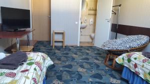 Una cama o camas en una habitación de Terve Hostel