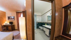 Postel nebo postele na pokoji v ubytování Hotel Al Ritrovo