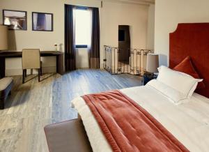Postel nebo postele na pokoji v ubytování Podere Castel Merlo Resort