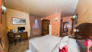 Postel nebo postele na pokoji v ubytování Hotel Al Ritrovo