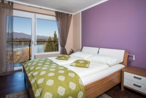 Voodi või voodid majutusasutuse Hotel Faaker See Inn by S4Y toas +37 fotot