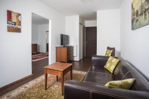 TV a/nebo společenská místnost v ubytování Hotel Faaker See Inn by S4Y