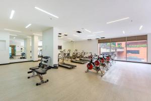 a gym with a lot of treadmills and machines at Amoblado Centro Internacional, Bogotá in Bogotá