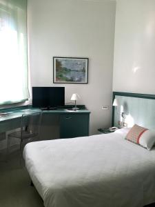 Postel nebo postele na pokoji v ubytování Hotel Europa
