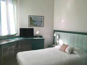 Postel nebo postele na pokoji v ubytování Hotel Europa