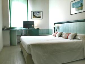 Postel nebo postele na pokoji v ubytování Hotel Europa
