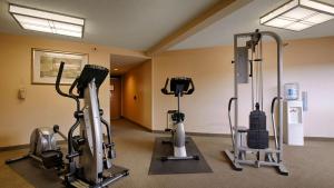 a gym with two treadmills and exercise bikes at Pacifica Lighthouse Hotel Trademark Collection by Wyndham in Pacifica