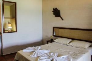 En eller flere senger på et rom på Pousada Vira Sol