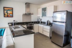 A cozinha ou cozinha compacta de Apt40 with Nice Seaview at BlueBay