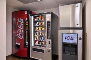 a cocacola machine next to a cocacola soda machine at Best Western Dayton Inn & Suites in Dayton