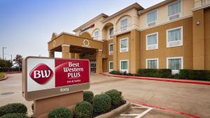 a best western plus sign in front of a building at Best Western Plus Katy Inn & Suites in Katy
