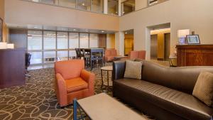 a lobby with a couch and chairs and a table at Best Western Executive Inn Kenosha - Pleasant Prairie in Kenosha