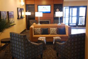 a living room with a couch and two chairs at Best Western Baraboo Inn in Baraboo