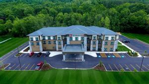 an aerial view of a hotel with a parking lot at Best Western Plus The Hammondsport Hotel in Hammondsport