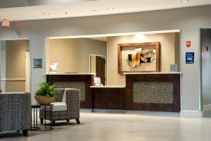 a waiting area in a hospital with a mirror at Best Western Plus The Hammondsport Hotel in Hammondsport +42 photos