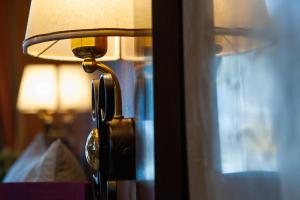 Postel nebo postele na pokoji v ubytování Hotel Al Ritrovo