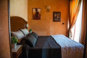 Postel nebo postele na pokoji v ubytování Hotel Al Ritrovo