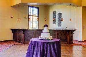 a wedding cake on a table in a room at The Wildwood Hotel in Wildwood