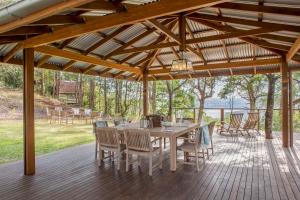 a wooden deck with a table and chairs at Spicers Clovelly Estate in Montville