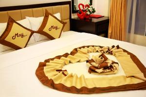 Voodi või voodid majutusasutuse May Hotel toas