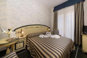 Postel nebo postele na pokoji v ubytování Hotel Morchio Mhotelsgroup