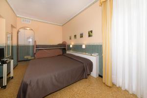 Postel nebo postele na pokoji v ubytování Hotel Morchio Mhotelsgroup