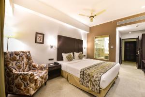 Postel nebo postele na pokoji v ubytování Silver Sands Serenity Resort, Candolim