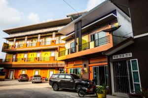 a car parked in front of a building at The Boat House in Ranong