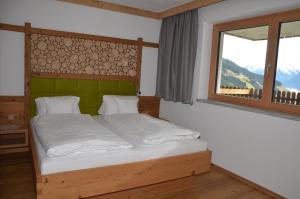 Postel nebo postele na pokoji v ubytování Bergsonne