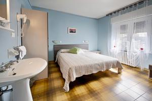 Postel nebo postele na pokoji v ubytování Albergo Mancuso del Voison