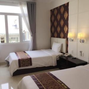 Postel nebo postele na pokoji v ubytování Lilly Hotel