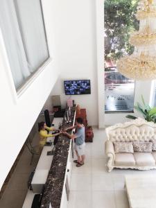 TV a/nebo společenská místnost v ubytování Lilly Hotel