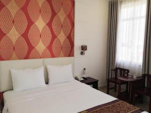 Postel nebo postele na pokoji v ubytování Lilly Hotel