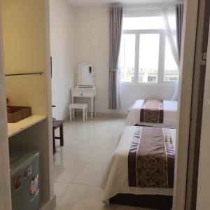 Postel nebo postele na pokoji v ubytování Lilly Hotel