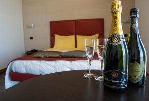 מיטה או מיטות בחדר ב-Hotel San Clemente