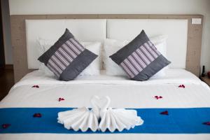 Ένα ή περισσότερα κρεβάτια σε δωμάτιο στο Prajaktra Design Hotel