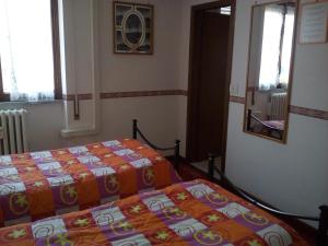 A bed or beds in a room at B&B La Cubanina