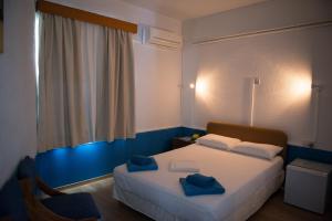 Кровать или кровати в номере Le Village Hotel