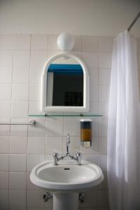 Ванная комната в Le Village Hotel
