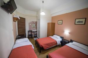 Posteľ alebo postele v izbe v ubytovaní Tempi Hotel