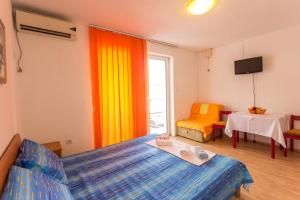 Ένα ή περισσότερα κρεβάτια σε δωμάτιο στο Apartmani Spaic