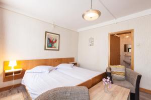Postel nebo postele na pokoji v ubytování Hotel DeFive