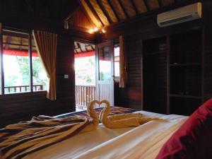 En eller flere senge i et værelse på Starfish Lembongan