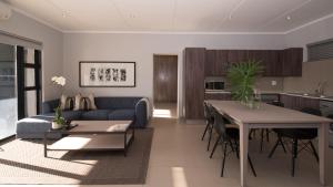 uma sala de estar com um sofá azul e uma mesa em Odyssey Luxury Apartments - Back Up Generator em Joanesburgo