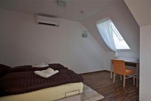 Postel nebo postele na pokoji v ubytování Pútnický mlyn