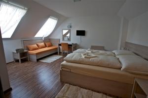 Postel nebo postele na pokoji v ubytování Pútnický mlyn