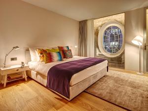 Postel nebo postele na pokoji v ubytování Hotel Anker Luzern
