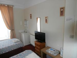 TV a/nebo společenská místnost v ubytování Monorene Guest House